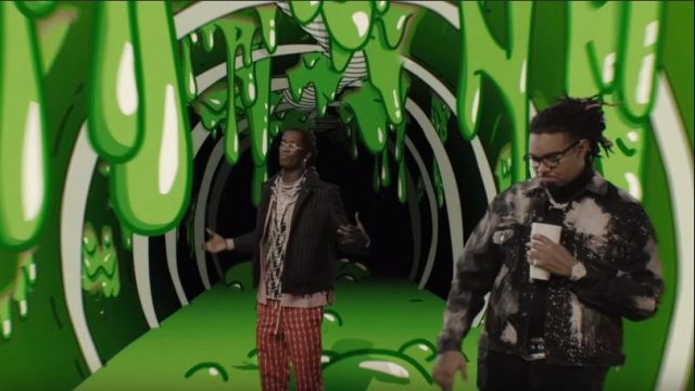 Balenciaga Black Paint stain denim jacket of Gunna in the music video Gunna - Three Headed Snake ft. Young Thug [Official Video]