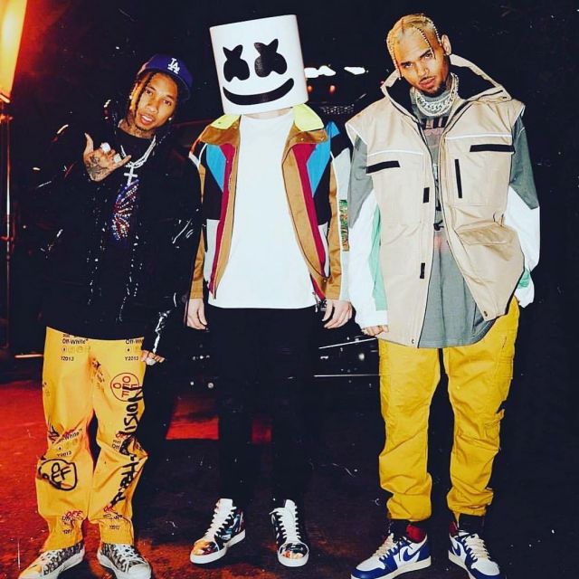 Dior Grey B23 High-Top Sneak­ers of Tyga on the Instagram account @chrisbrownofficial