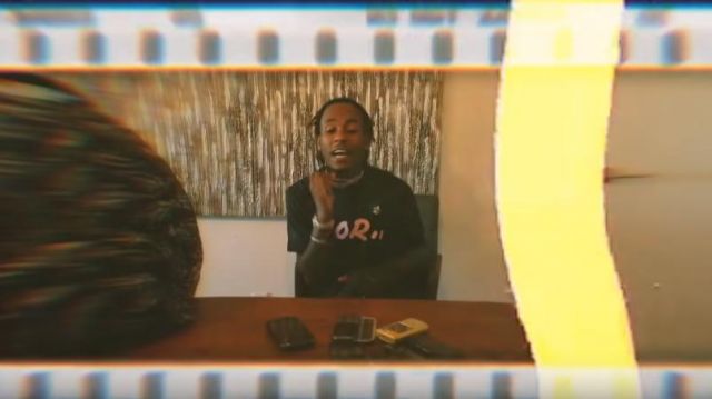 Dior × kaws Black Print­ed Tee of Rich the Kid in the music video Rich The Kid - 4 Phones [Official Music Video]