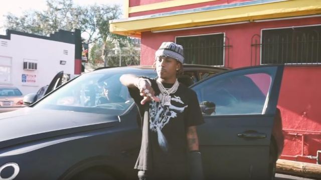 Givenchy Black Trib­al Tar­ius print T-shirt of Rich the Kid in the music video Rich The Kid - 4 Phones [Official Music Video]