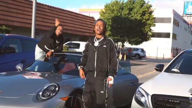 Amiri Black side leather stripe track pants of Rich the Kid in the music video Rich The Kid - 4 Phones [Official Music Video]