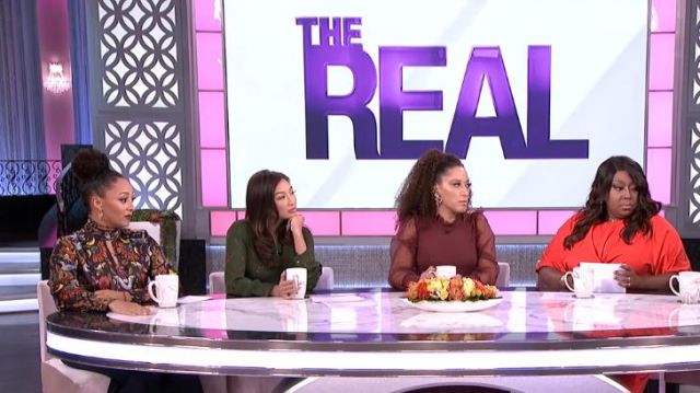 Cinq à Sept Black Flo­ral Print Top worn by Tamera Mowry on The Real (2013) November 13,2019