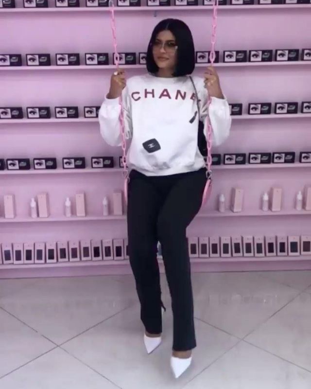 Prada Ban­doliera Cross Body Bag worn by Kylie Jenner Instagram Stories November 24, 2019
