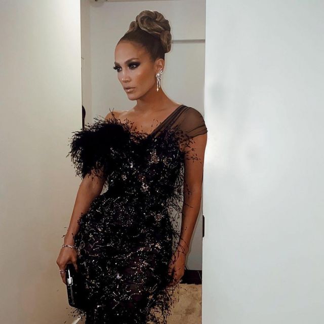 Clemmie Black Shiny Python Clutch Bag of Jennifer Lopez on the Instagram account @jlo December 4, 2019