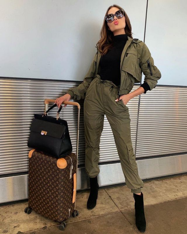 Jonathan Simkhai Taffe­ta Wind­break­er worn by Olivia Culpo Leaving Miami December 6, 2019
