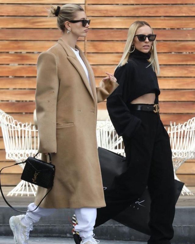 Balenciaga Sus­pend­ed Shoul­der Coat Jaune Acide worn by Hailey Baldwin Beverly Hills December 10, 2019