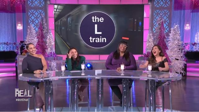 Eloquii Pur­ple Tie Waist Dress worn by Loni Love on The Real (2013) December 13, 2019