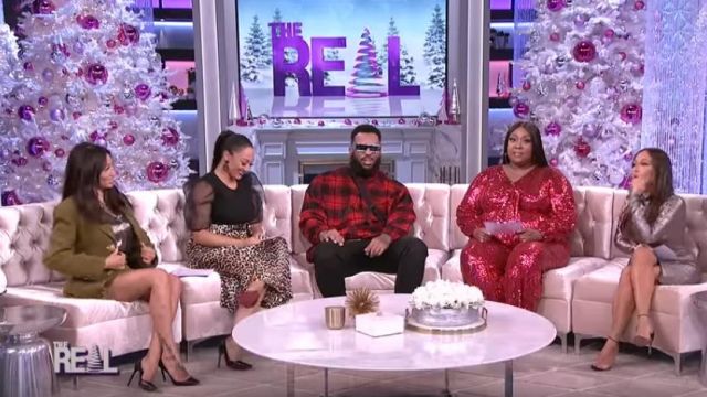 Eloquii Se­quin Tie Front Long Sleeve Jump­suit worn by Loni Love on The Real December 18, 2019