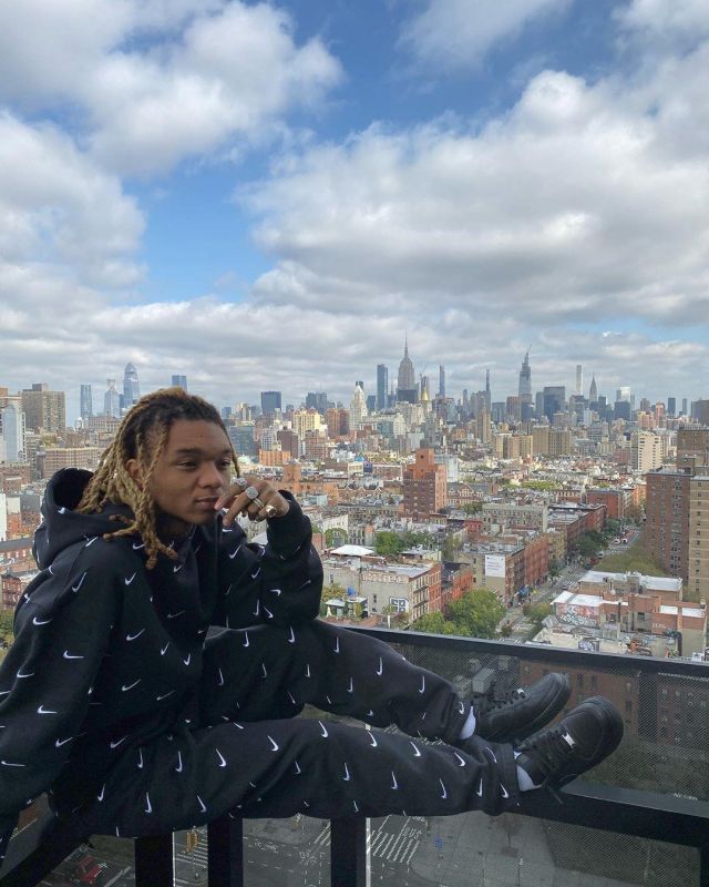 The hoodie nike black and white with several swooshs worn by Swae Lee on the account Instagram of @swaelee