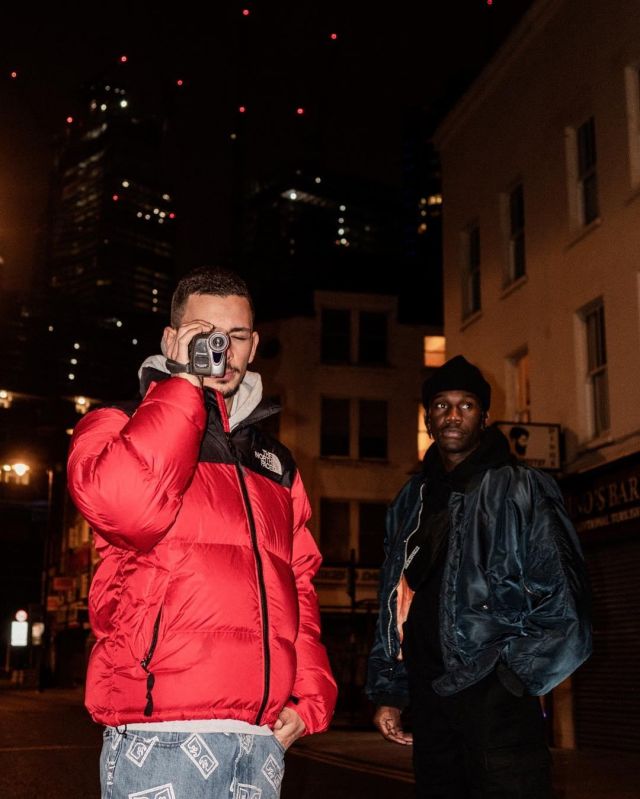 The down jacket red The North Face scope by Elyo account on the Instagram of @elyo_vision