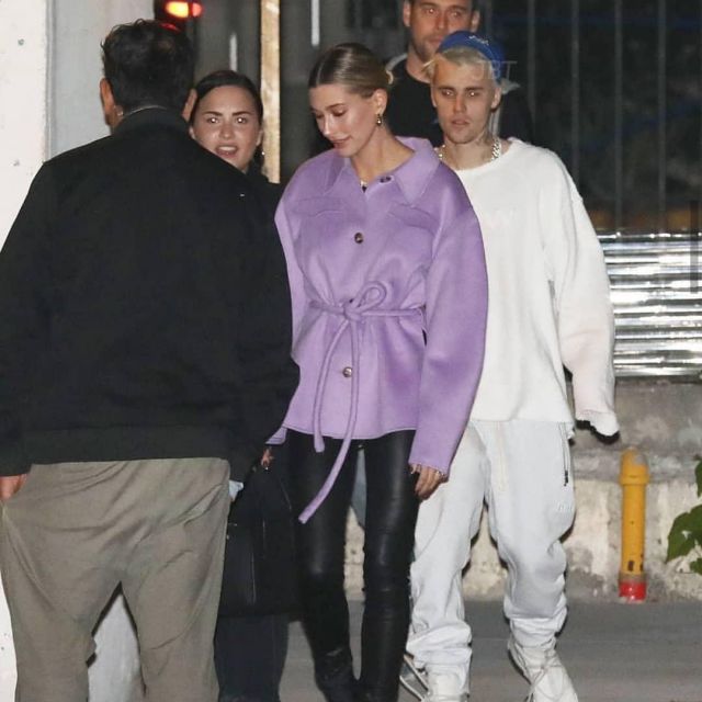 The Row Sporty Leather Duf­fel Bag worn by Hailey Baldwin Going to Church December 18, 2019