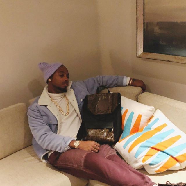 The sweater with a white turtleneck worn by B. o. B. on the account Instagram of @bob