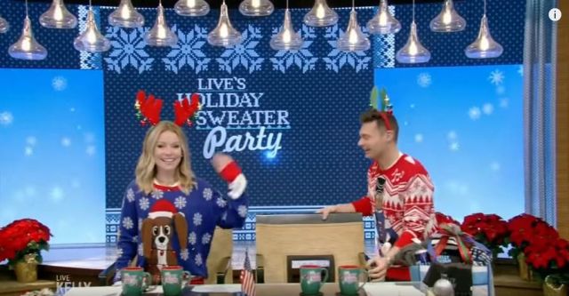 Costume agent Flap­py Dog An­i­mat­ed Pup­py Ears Ug­ly Christ­mas Sweater worn by Kelly Ripa on LIVE with Kelly and Ryan December 20, 2019