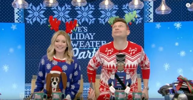 Costume agent Flap­py Drum­mer Boy An­i­mat­ed Ug­ly Christ­mas Sweater worn by on LIVE with Kelly and Ryan December 20, 2019