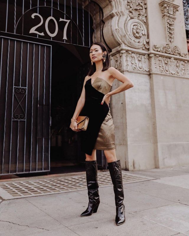 Tory Burch Black Knee High Boot of Christine Kong on the Instagram account @dailykongfidence