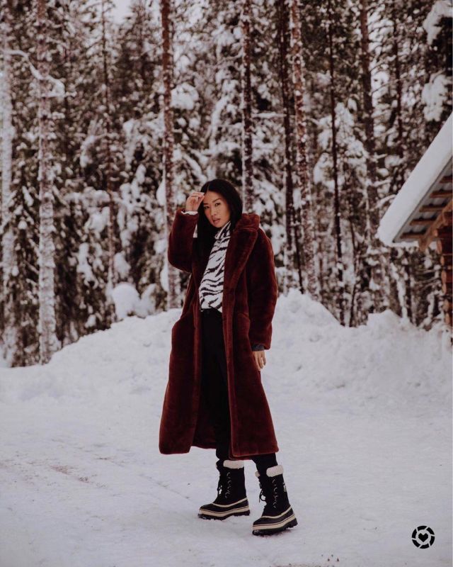 Sorel Cari­bou Boots of Christine Kong on the Instagram account @dailykongfidence
