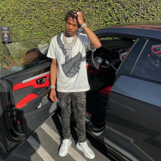 Amiri Print Dis­tressed Jeans of Lil Baby on the Instagram account @lilbaby_1
