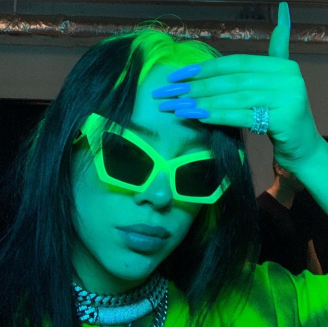 Green sun glasses worn by Billie Eilish on the Instagram account @billieeilish