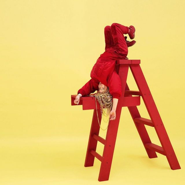 Red pants worn by Billie Eilish on the Instagram account @billieeilish