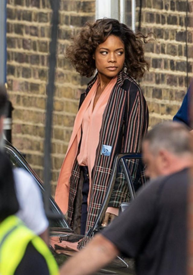 Paul Smith Check pattern mac coat worn by Naomie Harris (Moneypenny) on the set of No Time To Die in London 