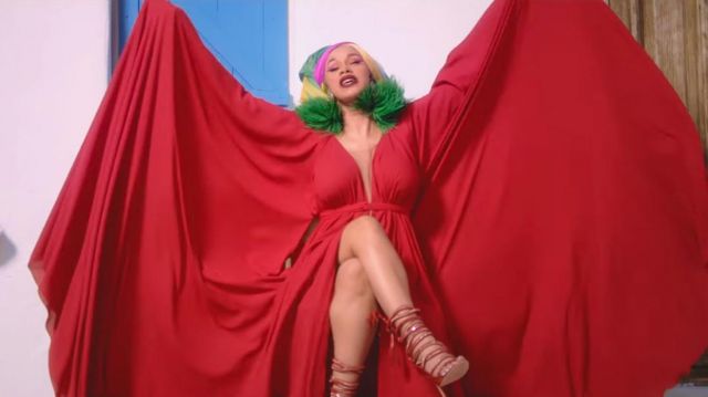 Red strappy high heel sandals of Cardi B in Cardi B, Bad Bunny & J Balvin - I Like It [Official Music Video]