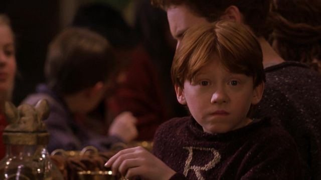 Le pull de Noël de Ron Weasley (Rupert Grint) dans Harry Potter à l'école des sorciers