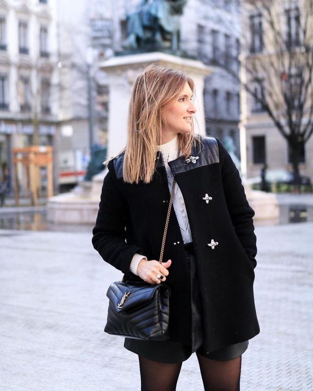 Le manteau noir Sandro porté par Maud sur le compte Instagram de @maudinettte