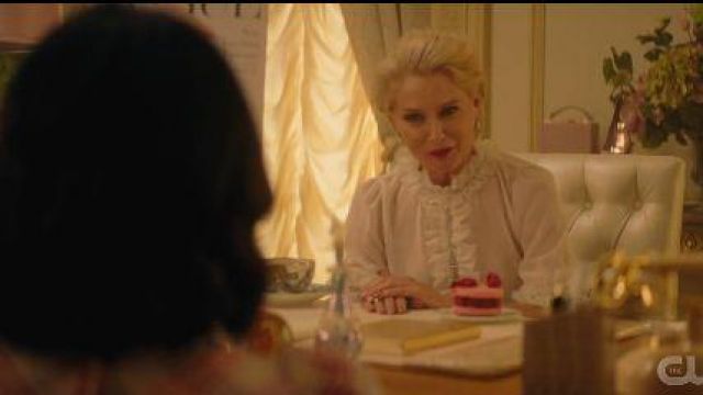 White Ruf­fle Trim Blouse worn by Gloria Grandbilt (Katherine LaNasa) in Katy Keene Season  1 Episode 2