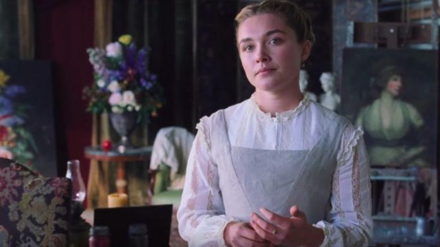 The shirt is white with a lace of Amy March (Florence Pugh) in The girls of doctor March