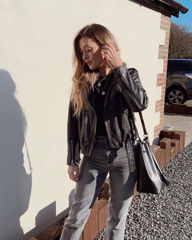 Mansur Gavriel Mi­ni Buck­et Black Bag of Charlotte Rose on the Instagram account @modelmouth