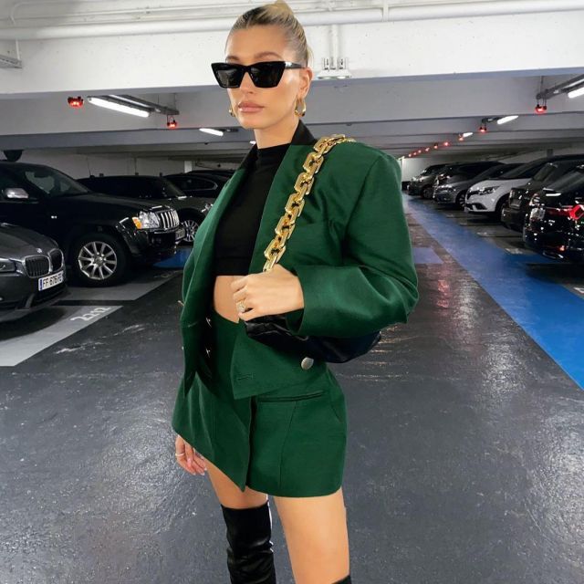 Bottega Veneta Twisted Triangle Hoop Earrings worn by Hailey Baldwin Paris February 26, 2020