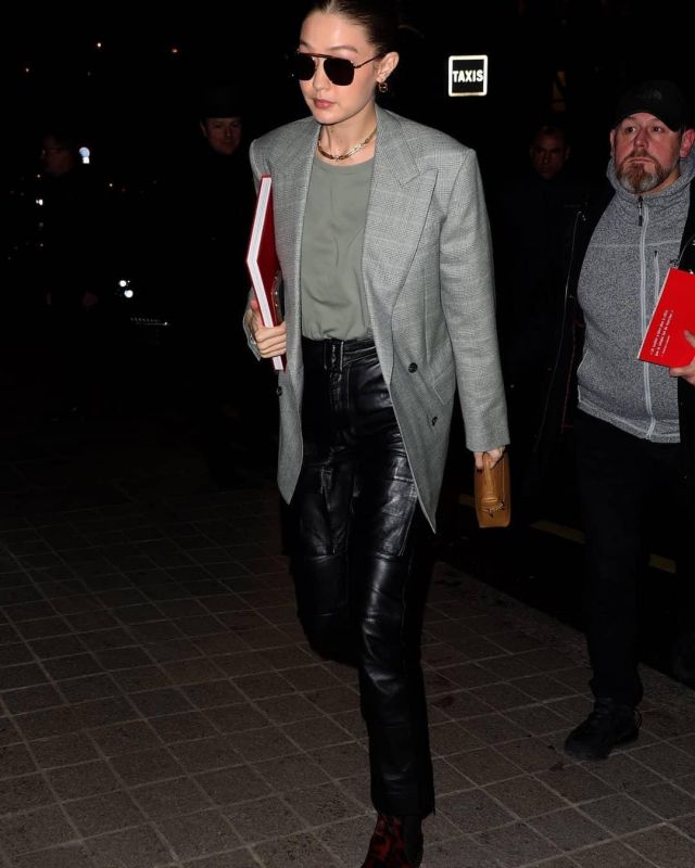 Christian Louboutin By The River Studded Leather Chelsea Boots worn by Jelena Noura "Gigi" Hadid Paris March 2, 2020