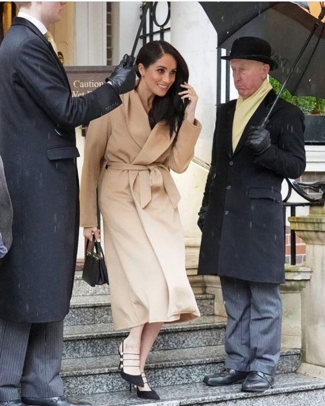 Alex Eagle Wrap Coat Dark Camel worn by Meghan Markle The Goring Hotel in London March 5, 2020
