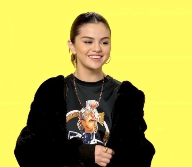Free People Turn Up Black Faux Fur Hooded Jacket worn by Selena Gomez Genius in Interview March 9, 2020