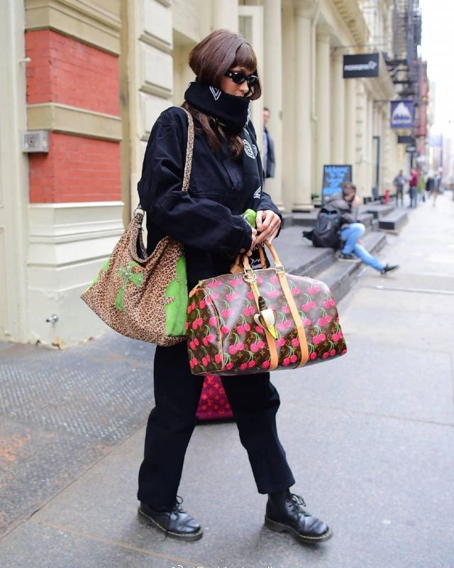 Fendi Ba­nana Leather & Jacquard Bag Charm Yel­low worn by Bella Hadid New York City March 12, 2020