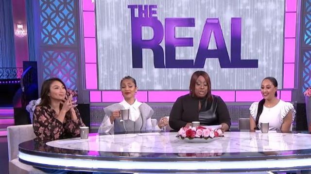 Topshop Flo­ral Print Ruf­fle Blouse worn by Jeannie Mai on The Real March 12, 2020