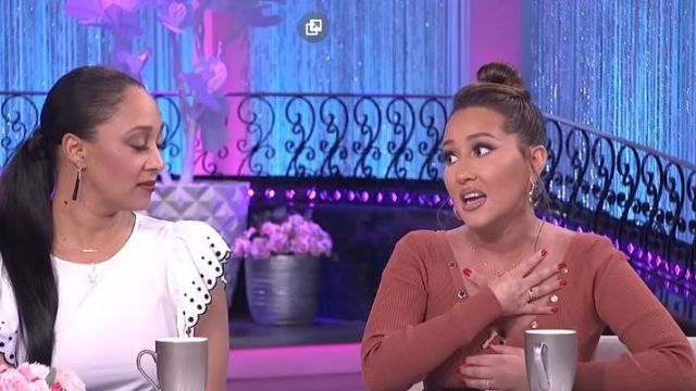 Sandro Trimmed Brand­ed Press Sweater worn by Adrienne Bailon on The Real (2013) March 13, 2020