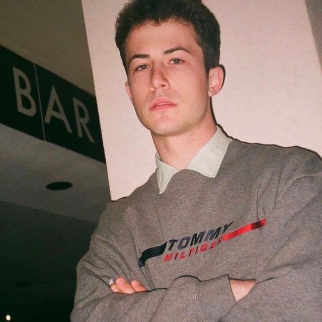 Tommy Hilfiger Grey Sweater worn by Dylan Minnette on his Instagram account @dylanminnette