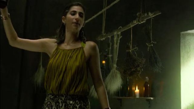 The top green pleated worn by Nairobi (Alba Flores) in the series La casa de papel (Season 4 Episode 6)
