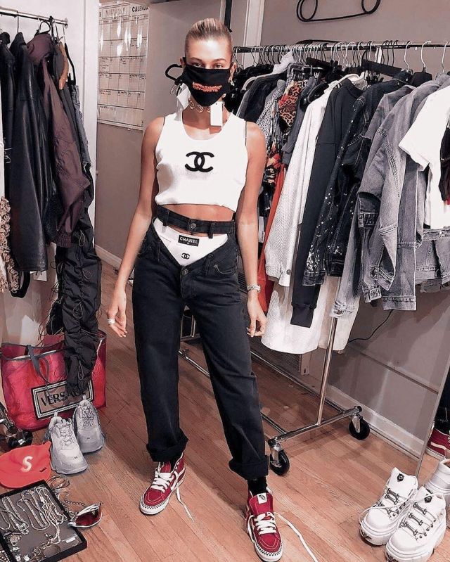 Chanel White Ribbed Lo­go Tank Top worn by Hailey Baldwin Maeve Reilly’s Instagram April 10, 2020