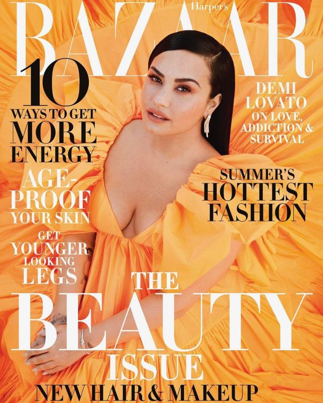 The long dress in taffeta with ruffles orange neon Demi Lovato is on the cover of Harper's Bazaar