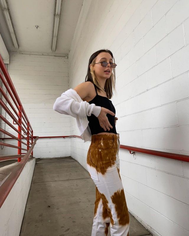 Eckhaus Latta Cow Print Slim Fit Jeans of Emma Chamberlain on the Instagram account @_emmachamberlain April 16, 2020