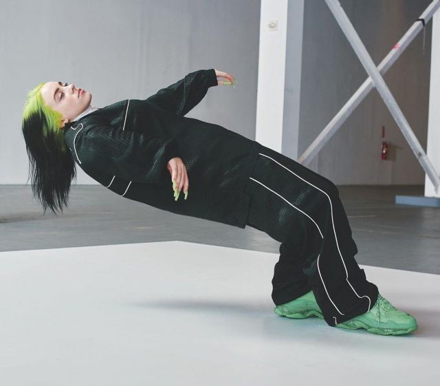 The pair of sneakers Balenciaga Triple S Neon Green worn by Billie Eilish on his account Instagram @billieeilish