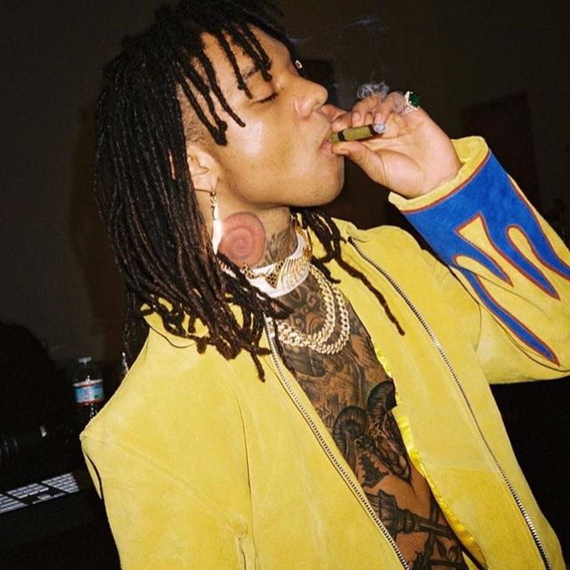 Yellow jacket with blue flames Ev Bravado scope by Swae Lee on the account Instagram of @swaellee