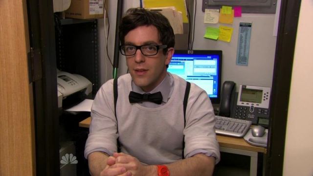 Glasses, Crew neck white sweater or t-shirt and orange watch worn by Ryan Howard (B. J. Novak) in The Office