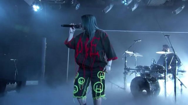 Tein Clothing Sad emoji shorts worn by Billie Eilish for her live performance at Jimmy Kimmel Live