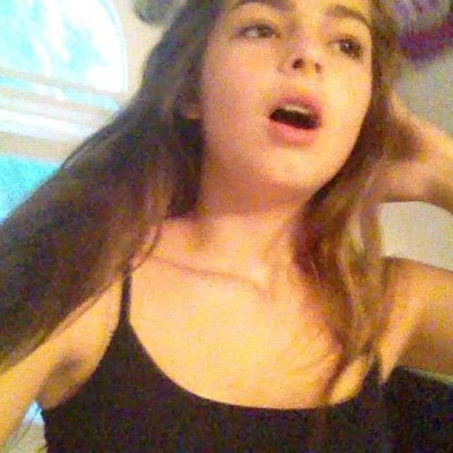 The tank top black thin straps worn by Addison Rae, on his account Instagram @addisonraee 