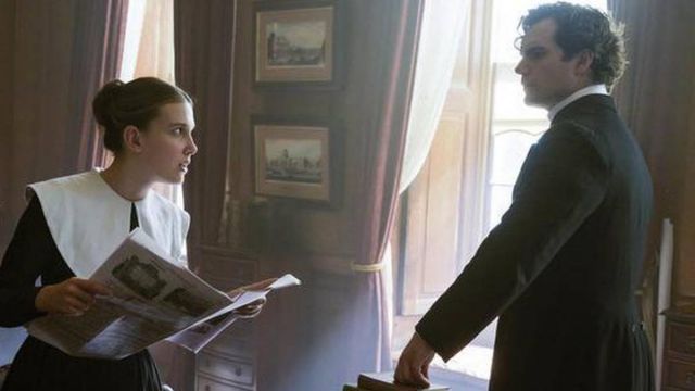 White collar black dress worn by Enola Holmes (Millie Bobby Brown) in Enola Holmes