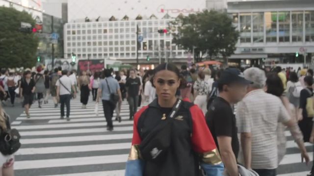 The banana, New Balance, black with the logo worn by Sydney McLaughlin in her video Photoshoot in the world's busiest intersection | Traveling with the Kid: Ep. 6