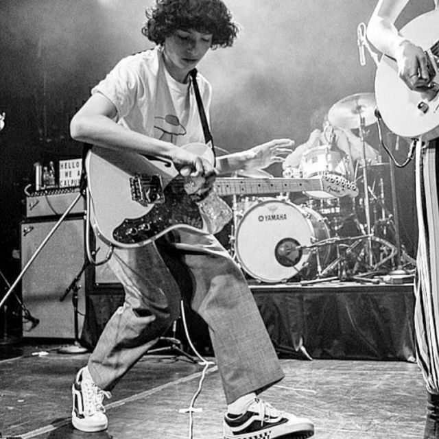 Vans white and black checkered sneakers worn by Finn Wolfhard  on the Instagram account @photographyaddictionn